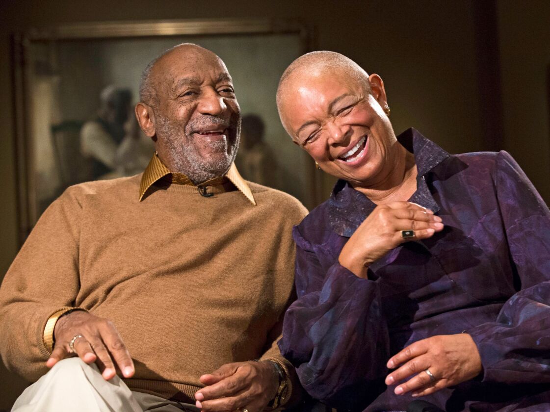 In this Nov. 6, 2014, file photo, Bill Cosby and his wife, Camille, laugh as they tell a story about collecting a piece in the exhibit “Conversations: African and African-American Artworks in Dialogue,” at the Smithsonian Institution’s National Museum of